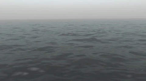 Ocean waves are gently and slowly rolling along in the haze (Looping, Hight Defi 스톡 동영상 65040