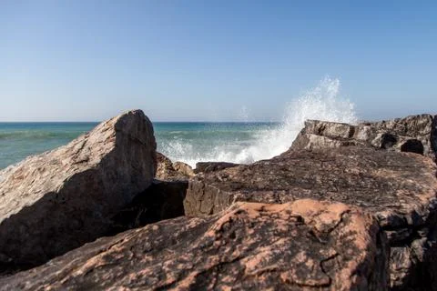 Ocean waves are hitting the rocks Stock Photos