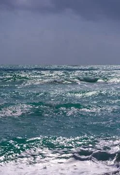 Ocean waves background. Tropical ocean waves. Blue seaside view. Foamy beach Stock Photos