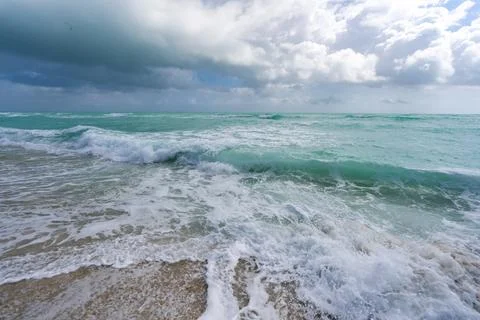 Ocean waves background. Tropical ocean waves. Blue seaside view. Foamy beach Stock Photos