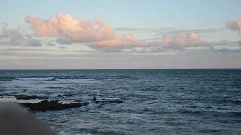 Ocean waves on a beach against a cloudy blue sky. Living nature. Atlantic O.. Stock Footage 313202611