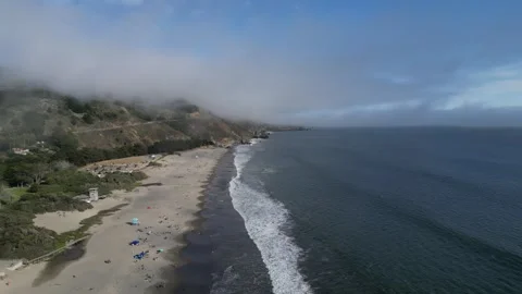 Ocean waves, beach and clouds in California Stock Footage 266064071