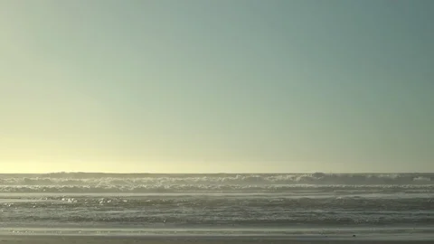 Ocean waves at beach during sunset Stock Footage 125787149