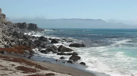 Ocean waves on a beach, hitting rock. Stock Footage 10578273