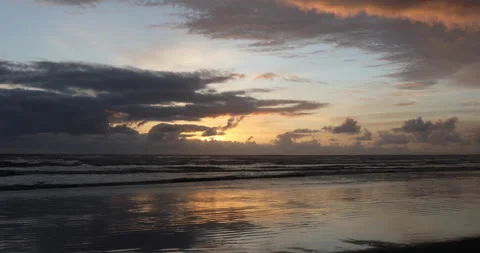 Ocean waves on beach at sunset Stock Footage 165264445