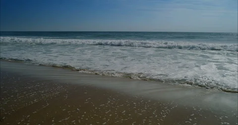 Ocean waves beat against the beach 01 8k Video stock 113674012