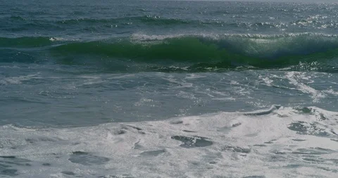 Ocean waves beat against the beach 8k Video stock 113674023