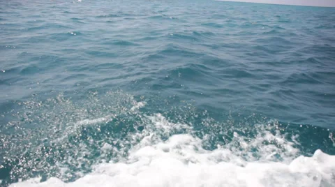 Ocean waves with boat wake Stock Footage 39566084