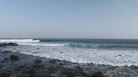 Ocean Waves Break Across Dark Volcanic Rocks Along Lanzarote Shoreline 스톡 동영상 344952843