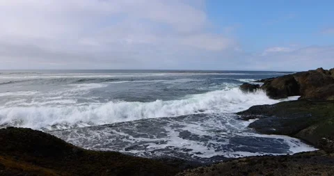 Ocean waves break along a rocky shore in Oregon 스톡 동영상 251483992