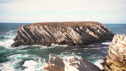 Ocean waves break on the coastal rock. Stock Footage 169632385