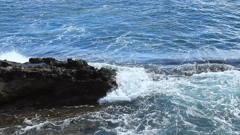 Ocean Waves Break On Jagged Rocks - Scenic Background Stock Footage 102156134