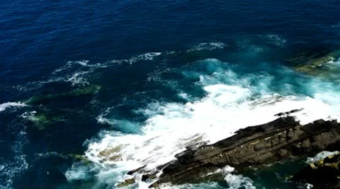 Ocean waves break on the rock Stock Footage 10772410