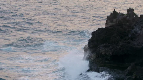 Ocean Waves Break the rocks of the shore Water turns into Foam Stock Footage 169488177