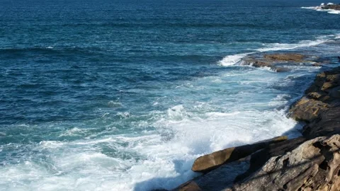 Ocean waves breaking against rocky Australian coastline Stock Footage 317975894