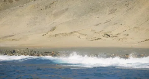 Ocean Waves Breaking Along Arid Rocky Shoreline in Mexico Stock Footage 341640387