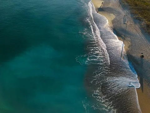 Ocean waves breaking on a beach Stock Photos