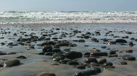 Ocean Waves Breaking onto Beach Rocks Stock Footage 352585