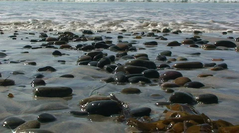 Ocean Waves Breaking onto Beach Rocks – Low Angle Stock Footage 352596