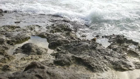 Ocean waves breaking on the black volcanic cliffs, stormy day. Storm season Video stock 166340528