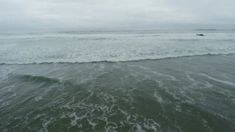 Ocean waves breaking on the Oregon coast aerial Video stock 348049813