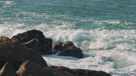 Ocean waves breaking over dangerous rocks in the Atlantic Ocean. Stock Footage 130628664