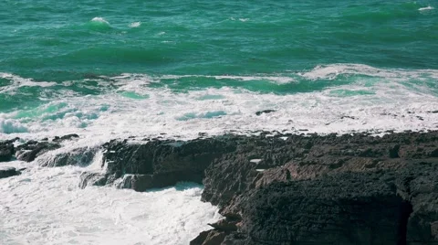 Ocean Waves Breaking on Rock Stock Footage 64289116