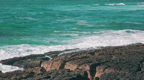 Ocean Waves Breaking on Rock Stock Footage 64289792