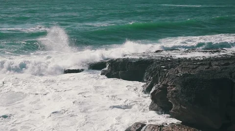 Ocean Waves Breaking on Rock Stock Footage 64290358
