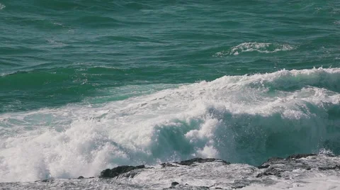 Ocean Waves Breaking on Rock Stock Footage 64290402