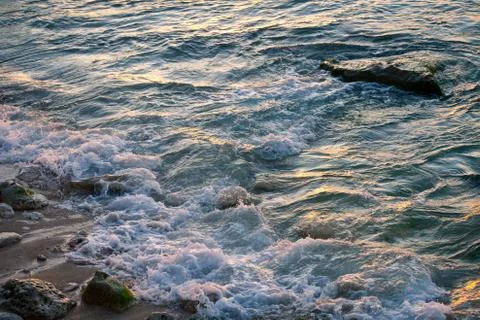 Ocean waves breaking on the rocks on the beach Stock Photos