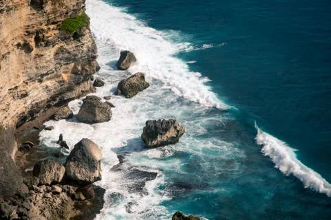 Ocean waves breaking on the rocks on the beach Stock Photos
