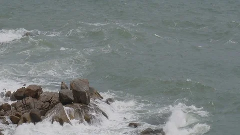 Ocean waves breaking on the rocks during a storm Stock Footage 80014930