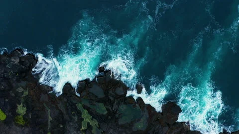 Ocean waves breaking on the rocks on the shore, aerial view. Faroe Islands Stock Footage 168606147