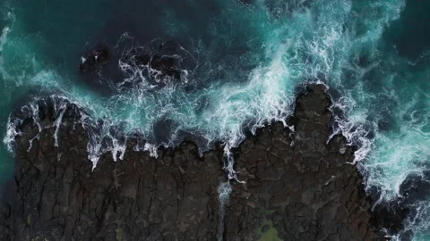 Ocean waves breaking on the rocks on the shore, aerial view. Faroe Islands Stock Footage 168606694
