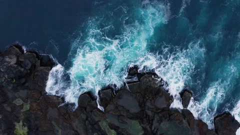 Ocean waves breaking on the rocks on the shore, aerial view. Faroe Islands Stock Footage 202123783