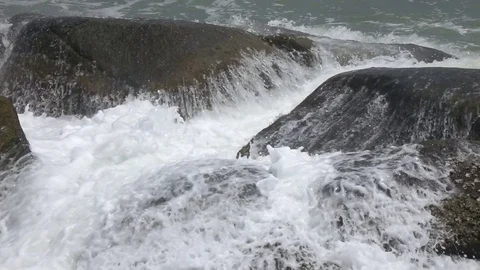 Ocean waves breaking on the rocks Slow motion Stock Footage