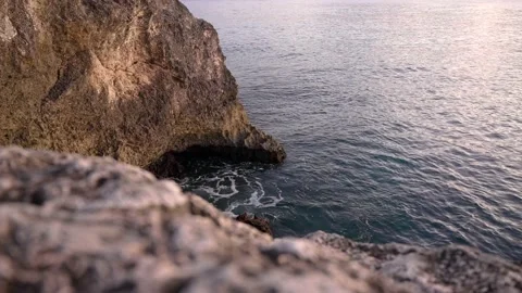 Ocean waves breaking by rocky cape. Stock Footage 168903229