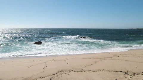 Ocean waves breaking on the sandy beach on sunny day in summer, slow motion Stock Footage 132016897