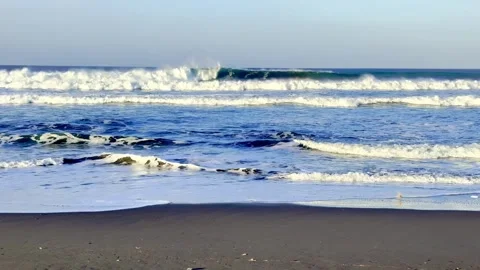 Ocean waves breaking on sandy beach shore Stock-Footage 335430686