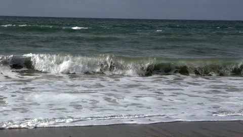 Ocean Waves Breaking on a Sandy Beach Shoreline in Iceland Stock Footage 339749102
