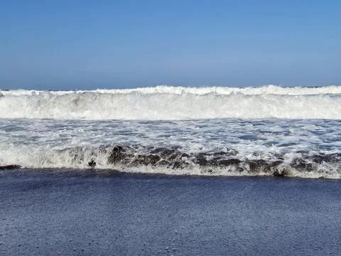 Ocean Waves Breaking on Sandy Beach 写真素材
