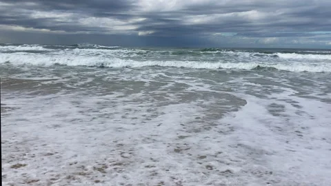 Ocean waves breaking on the shoreline Stock Footage 276155773