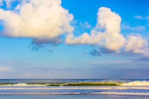 Ocean waves, clouds and blue sky in Bali 写真素材