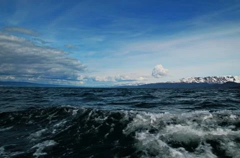 Ocean waves with clouds Stock Photos