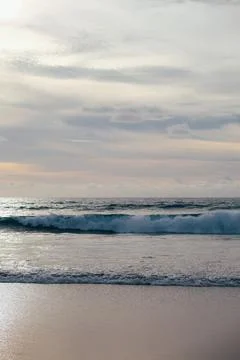 Ocean waves with cloudy sky over horizon. Photos