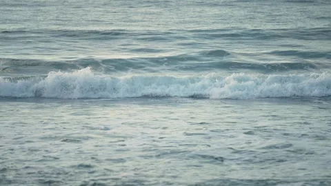 Ocean waves coming ashore generating foam at dusk in Cilento. Texture of waves Video stock 255795276