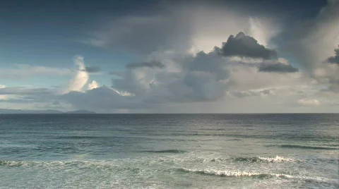 Ocean waves coming into shore with clouds behind Stock Footage 625475