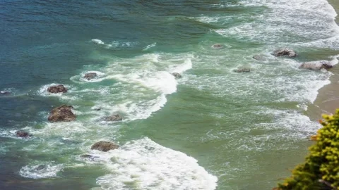 Ocean waves crash against rocks on the Oregon coast near Sand Lake. Stock Footage 326708316