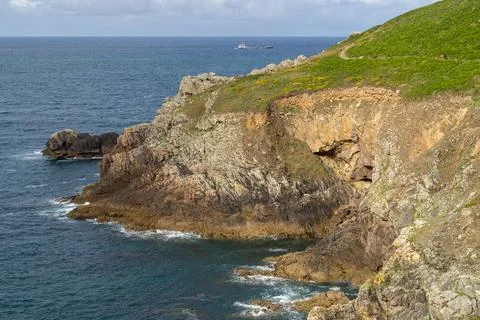 Ocean waves crash against the rocks. Pont du Raz June 10, 2026. Stock Photos